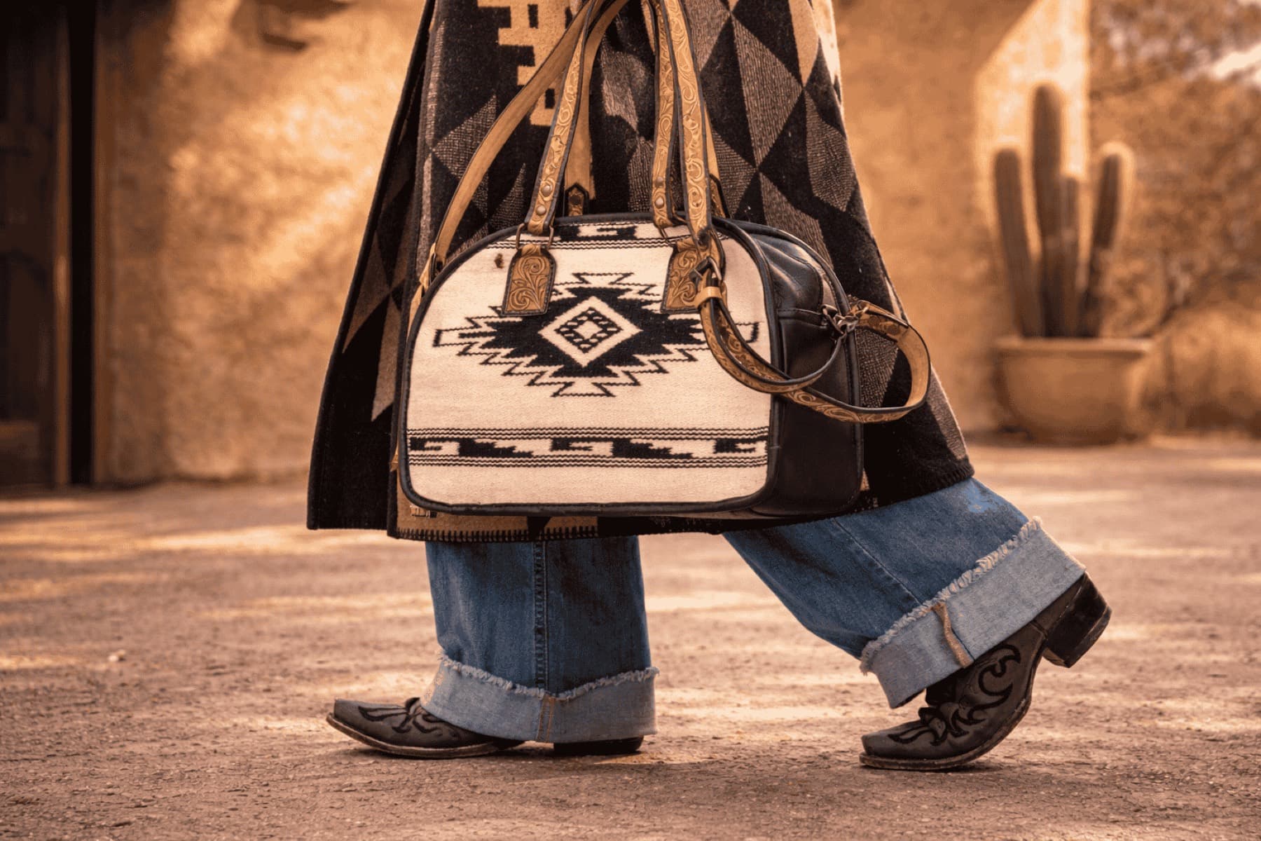 Reins Western Goods — a southwestern-patterned handbag styled with denim and boots from the brand shoot